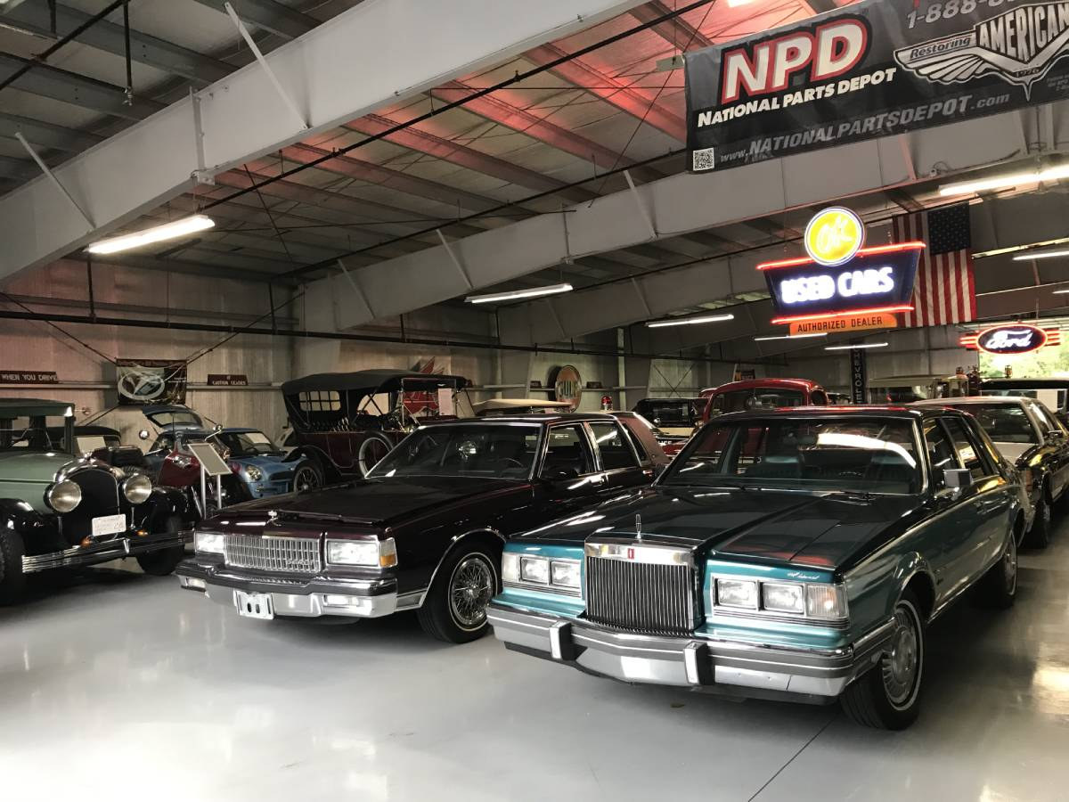 large garage filled with antique automobiles