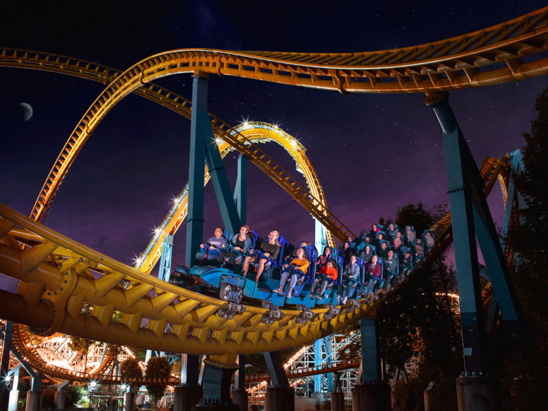 people riding a roller coaster at Hersheypark In The Dark