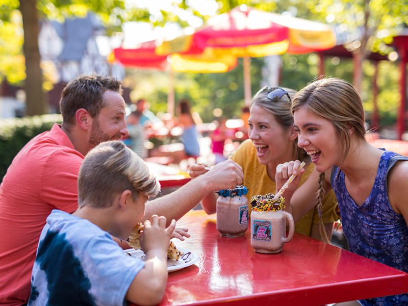 Family enjoying king sized chocolate shakes at HersheyPark