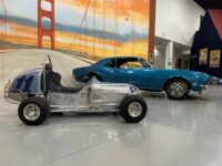 two antique racecars at the AACA car museum